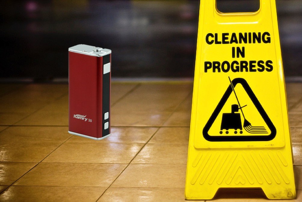 Box mod vape next to a cleaning sign