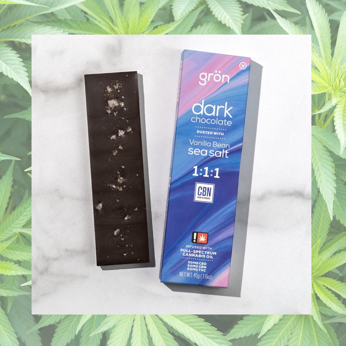 gron dark chocolate on marle slate with hemp flowers in the background 