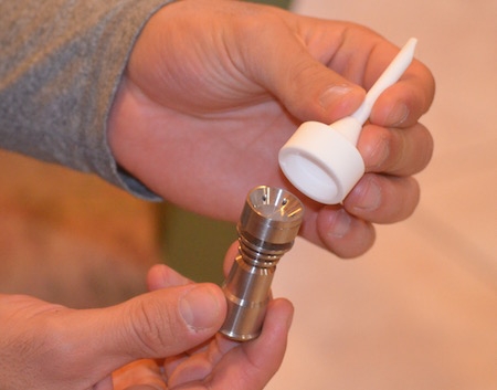 Hands Using a Carb Cap with Domeless Nail
